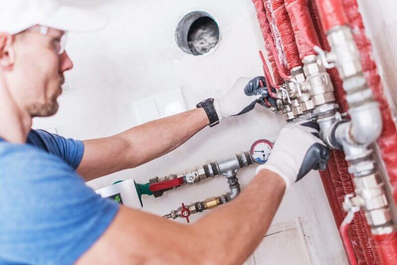 Commercial plumber in Penrith inspecting a sewer line at a Penrith shopping center